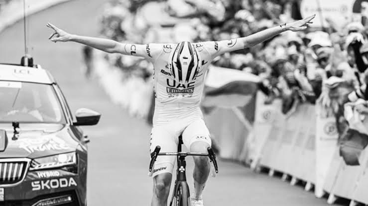 Cyclist celebrating at a race finish.