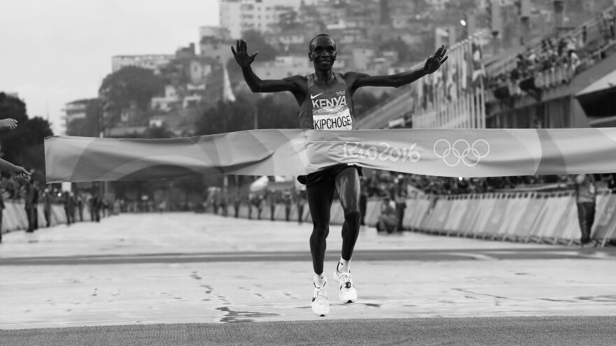 Runner crossing a finish line.